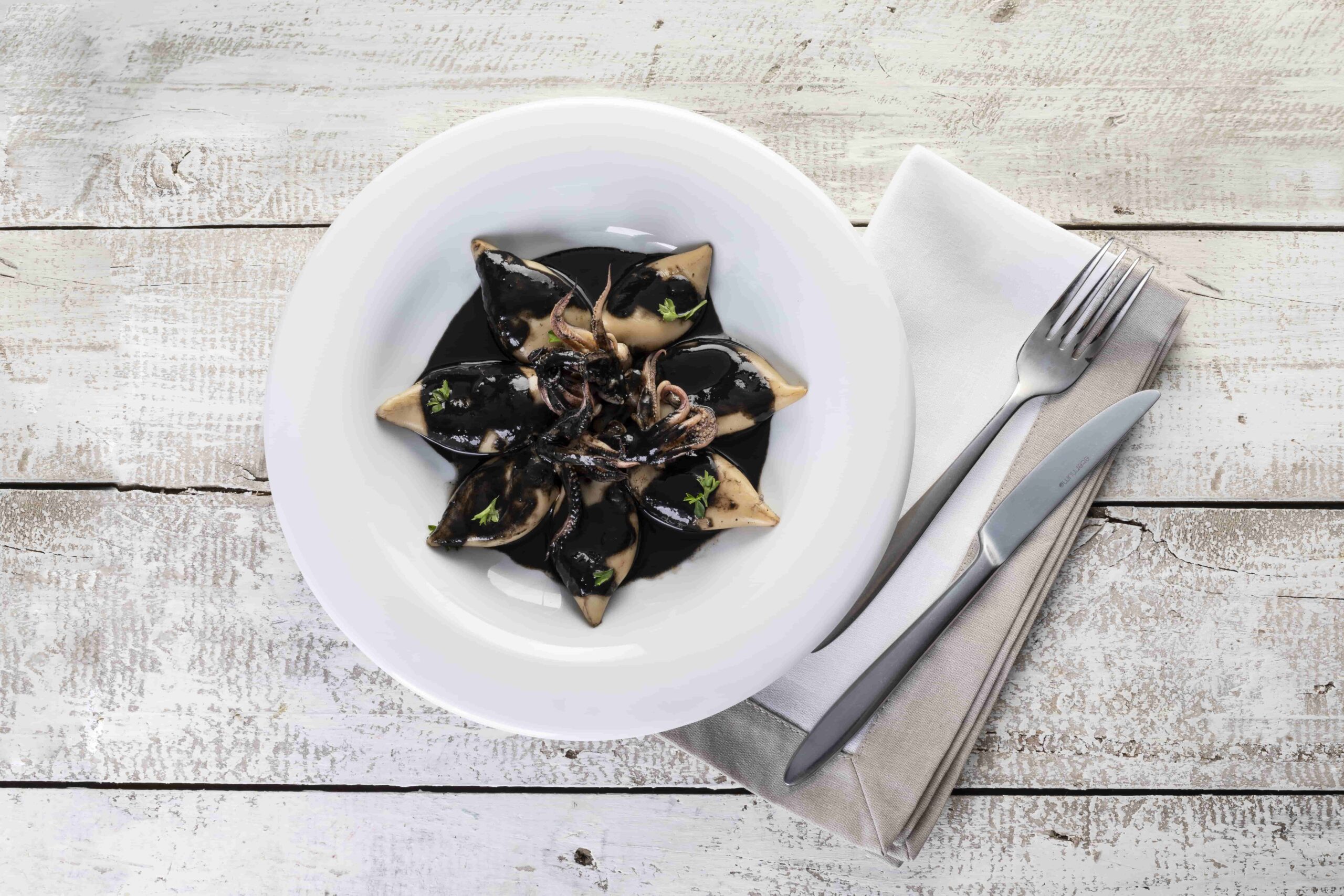 Calamares en su tinta fish solutions para hosteleria